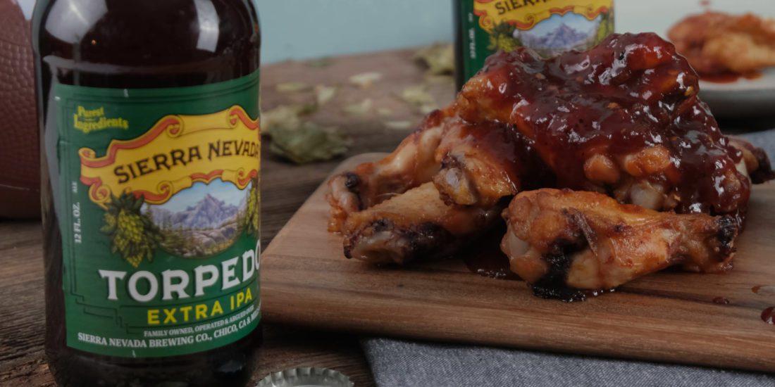 Chicken wings next to Torpedo IPA